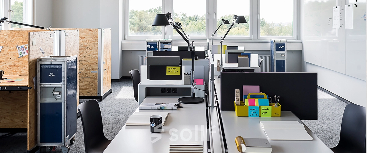 Modern office space at Rosenheimer Straße 143C, München Werksviertel, featuring sleek workstations, ample natural light, and practical furnishings, ideal for office space rental.