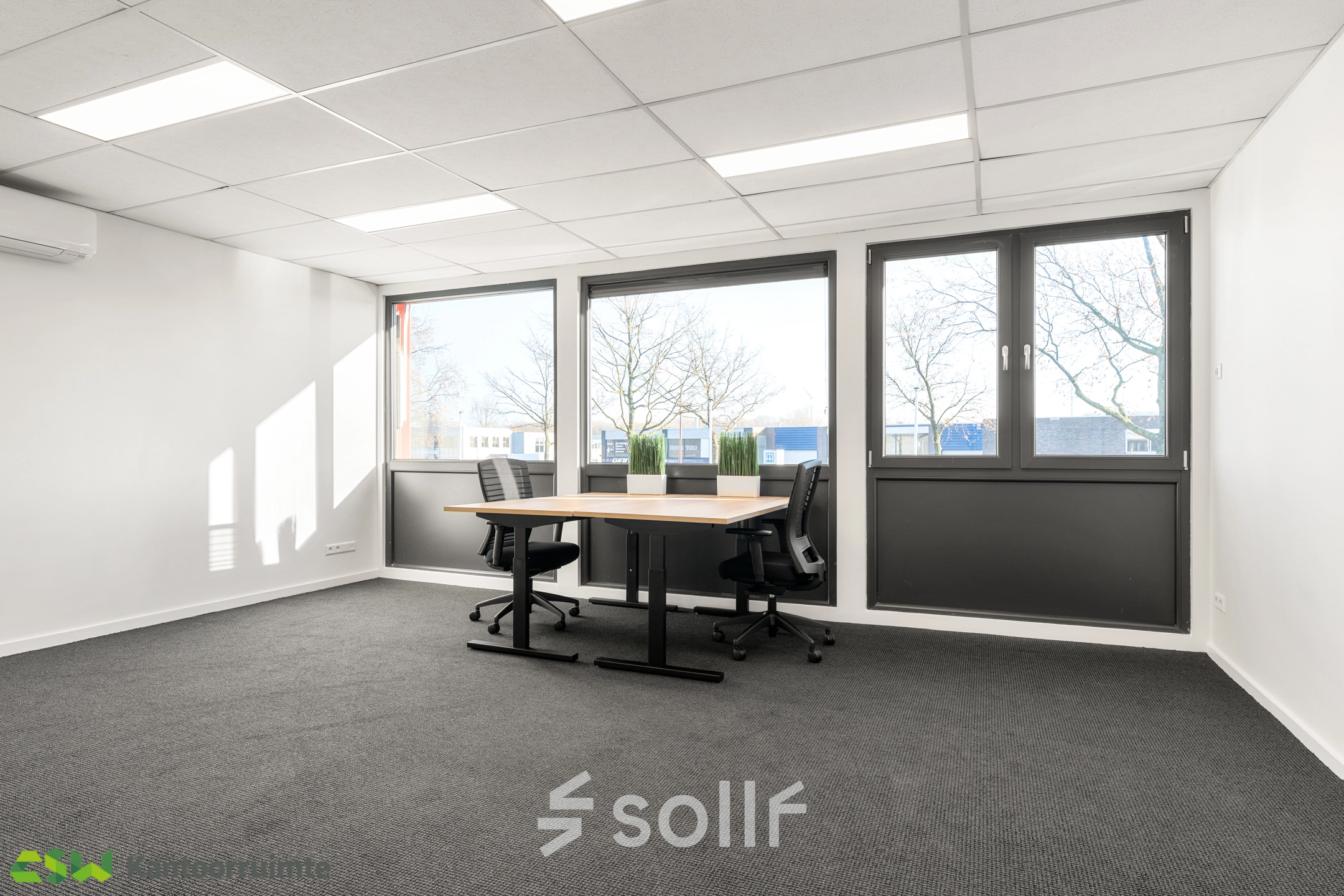Bright office space at Nijverheidsweg 9B, Nieuwegein available for rent. Features large windows and minimalist furnishings ideal for productive work.