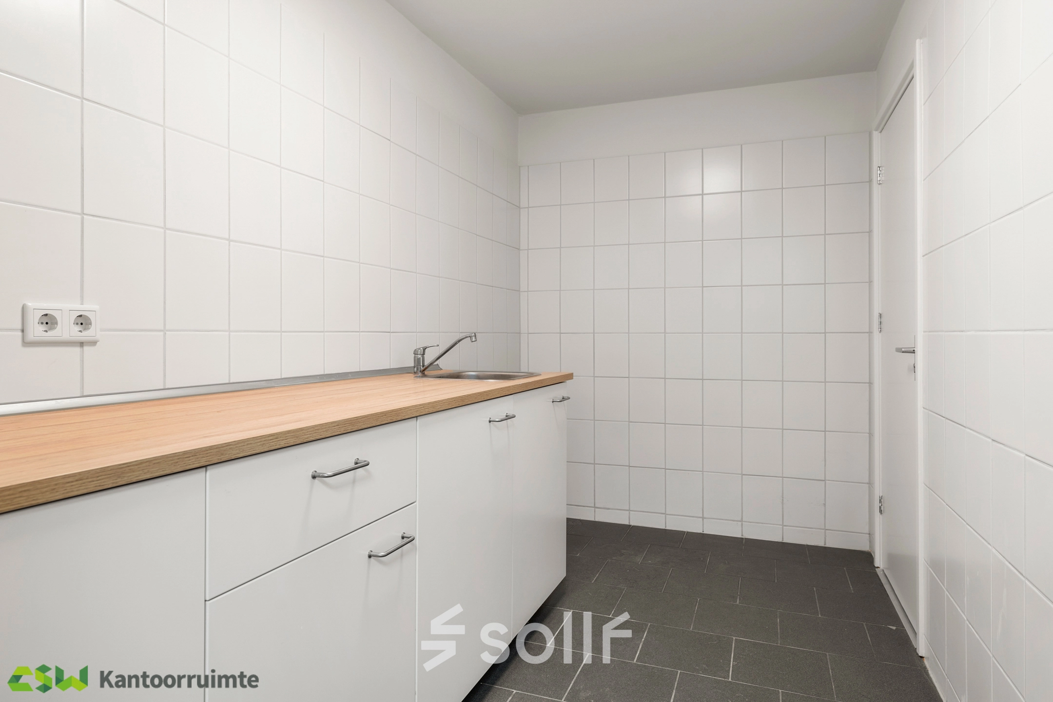Clean and bright pantry area with white cabinets and a countertop, located at Nijverheidsweg 9B, Nieuwegein. Ideal for those considering office space rental.