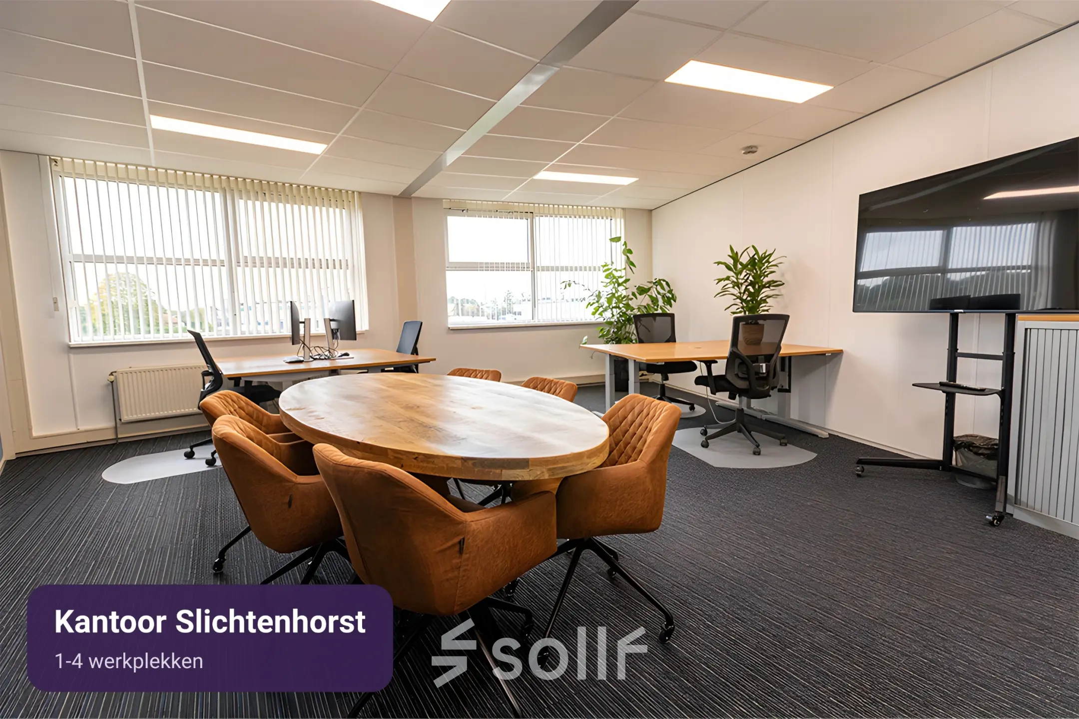 Modern office space at Patroonstraat 13, Nijkerk, featuring a round table and several workstations under natural light, available for office space rental.