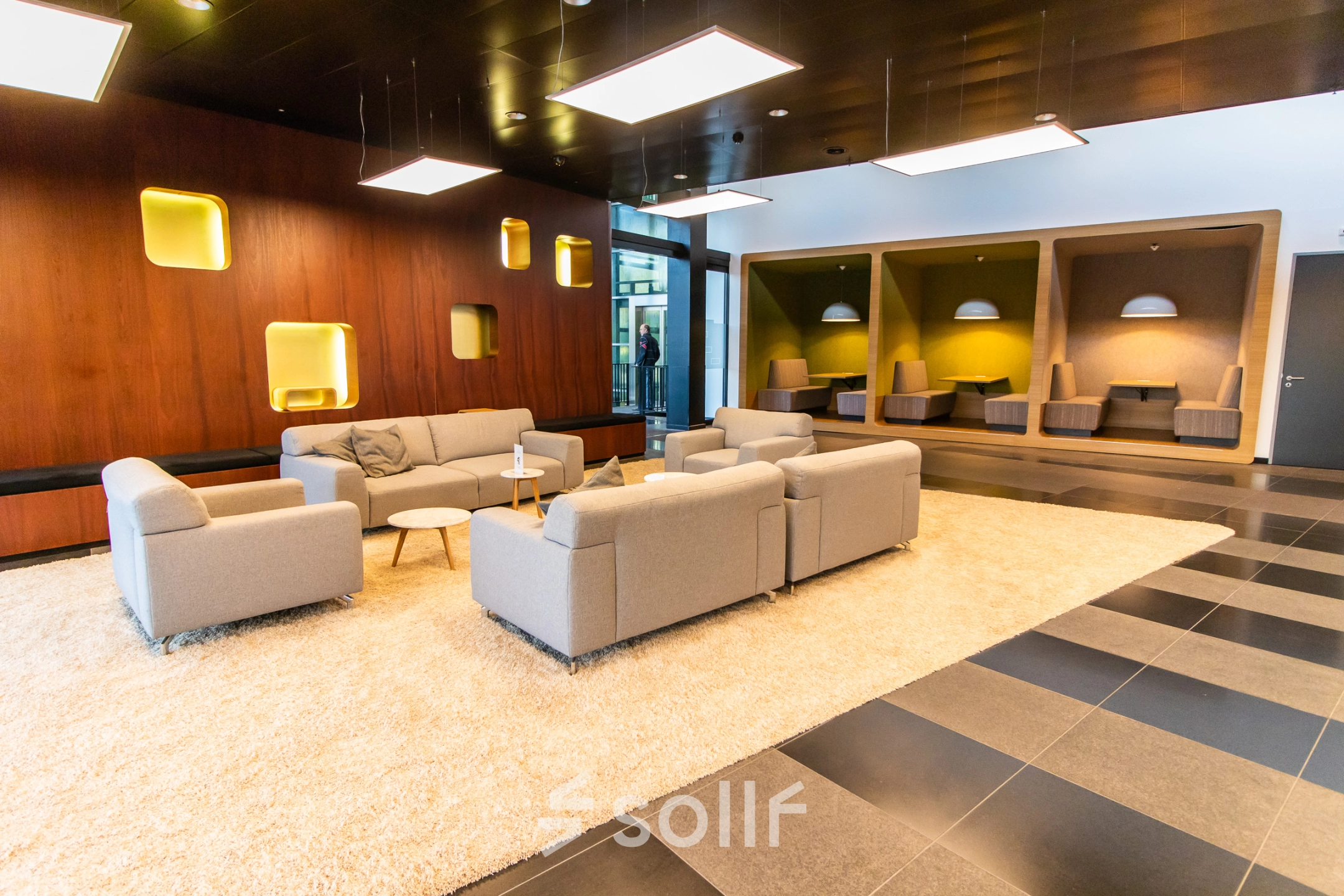 Modern furnished office space with cozy seating area, located at Jonkerbosplein 52 in Nijmegen. Ideal for office space rental.