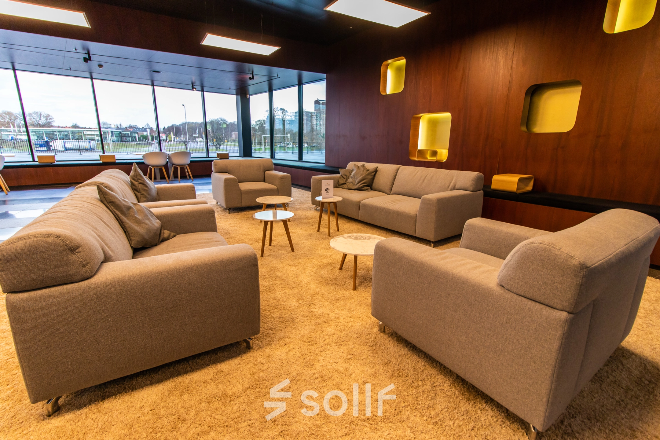 Modern lounge at Jonkerbosplein 52, Nijmegen with comfortable sofas and chic decor, perfect for office space rental needs.