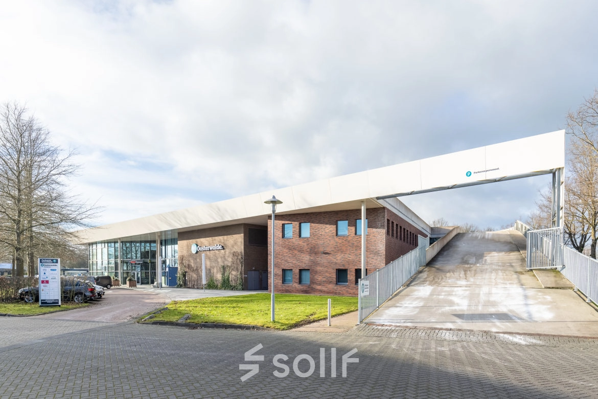 Exterior view of an office building located at Veengang 1, Oosterwolde, ideal for office space rental.