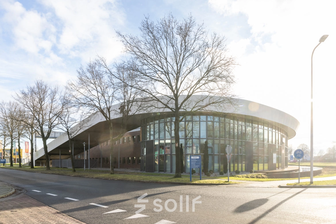 Exterior view of the modern office building at Veengang 1, Oosterwolde, available for office space rental.