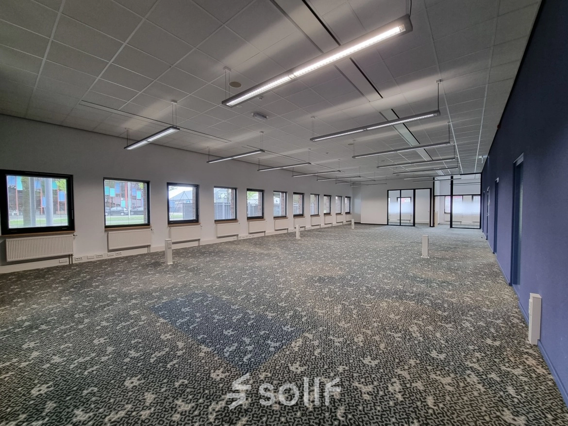 Bright office space at Veengang 1, Oosterwolde, featuring large windows and ample lighting, perfect for rent office space or office space rental needs.