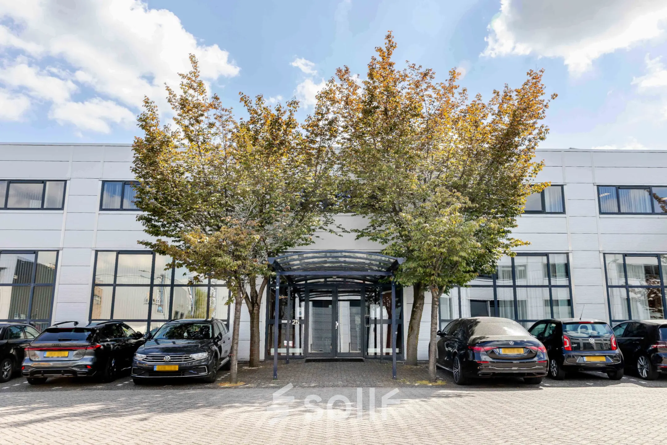Exterior view of the office at Leeghwaterstraat 25, Reeuwijk, featuring a modern facade and parking area.