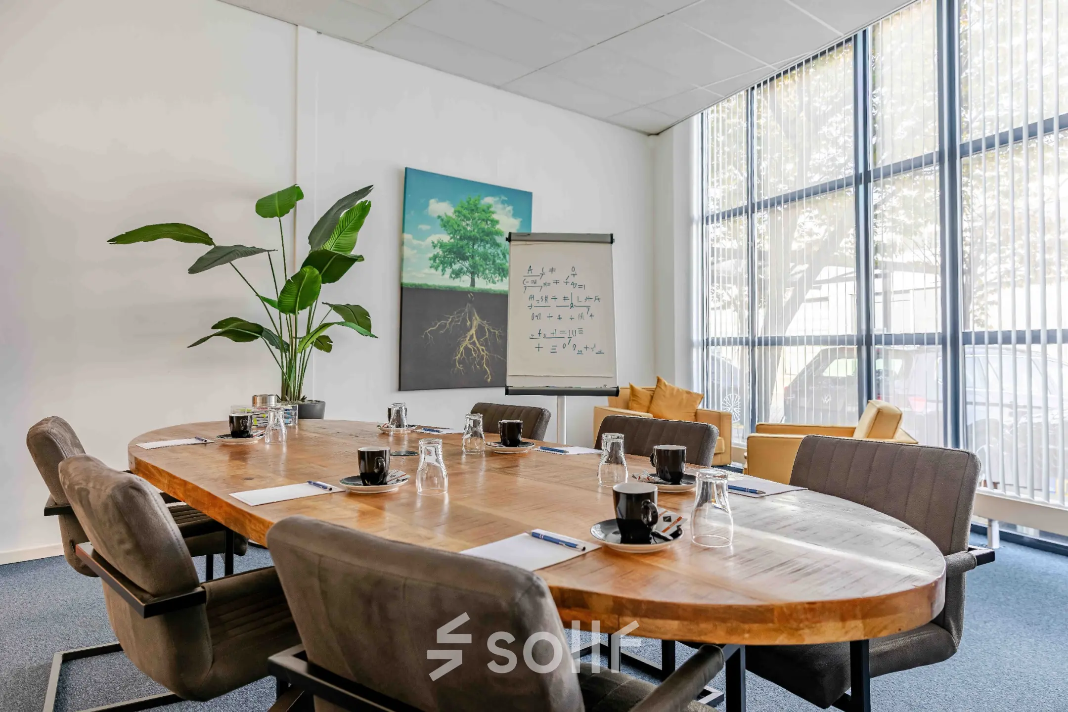 Well-lit conference room at Leeghwaterstraat 25, Reeuwijk, featuring a large table and chairs, suitable for office space rental.