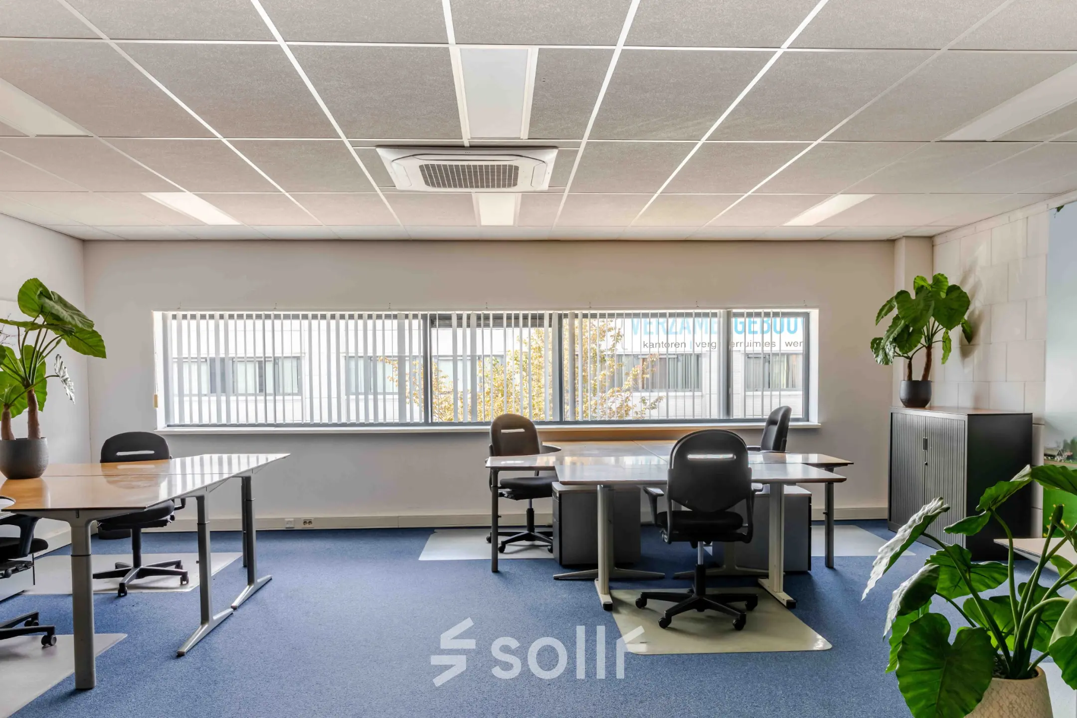 Spacious, brightly lit office with multiple desks and chairs available for rent at Leeghwaterstraat 25, Reeuwijk. Ideal for office space rental.