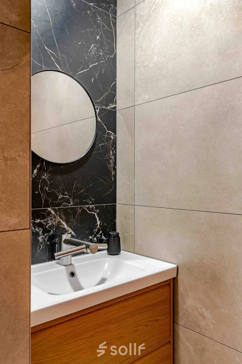 Bathroom area with a modern sink and stylish mirrored wall at Leeghwaterstraat 25, ideal for an office to rent in Reeuwijk.