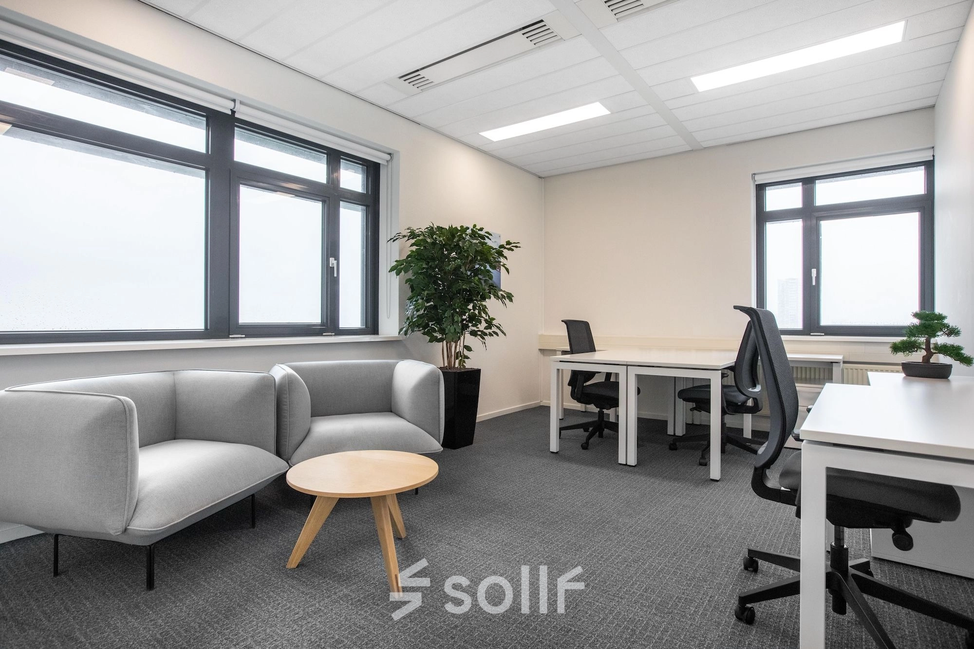 Modern office space rental at Einsteinlaan 28, Rijswijk, featuring a bright, furnished interior with seating and workstations.