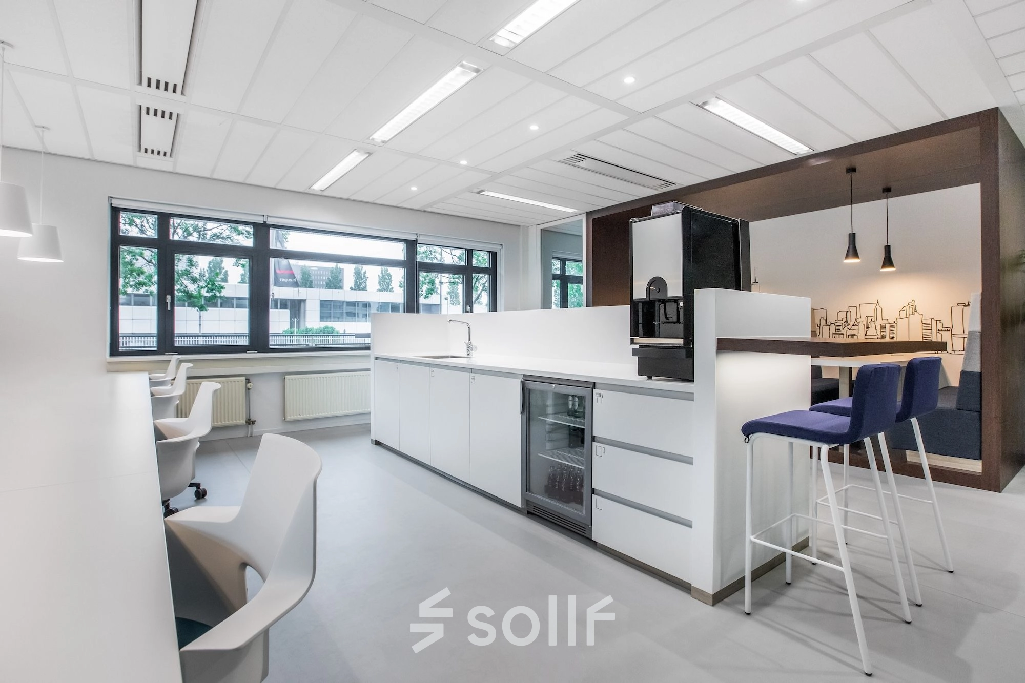 Modern office space for rent at Einsteinlaan 28, Rijswijk, featuring a bright interior with sleek furnishings and ample seating.