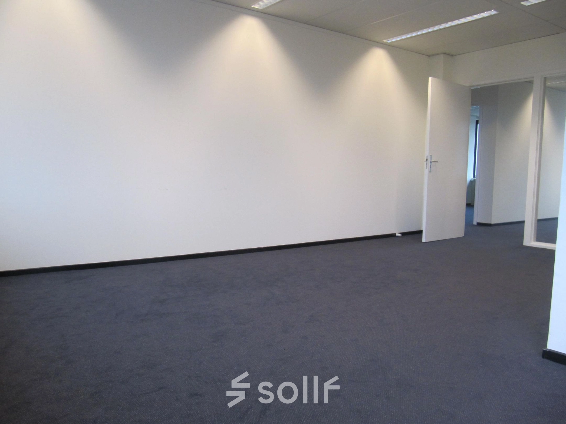 Spacious office to rent at JC van Markenlaan 3, Rijswijk, with neutral walls and carpet, ideal for office space rental.