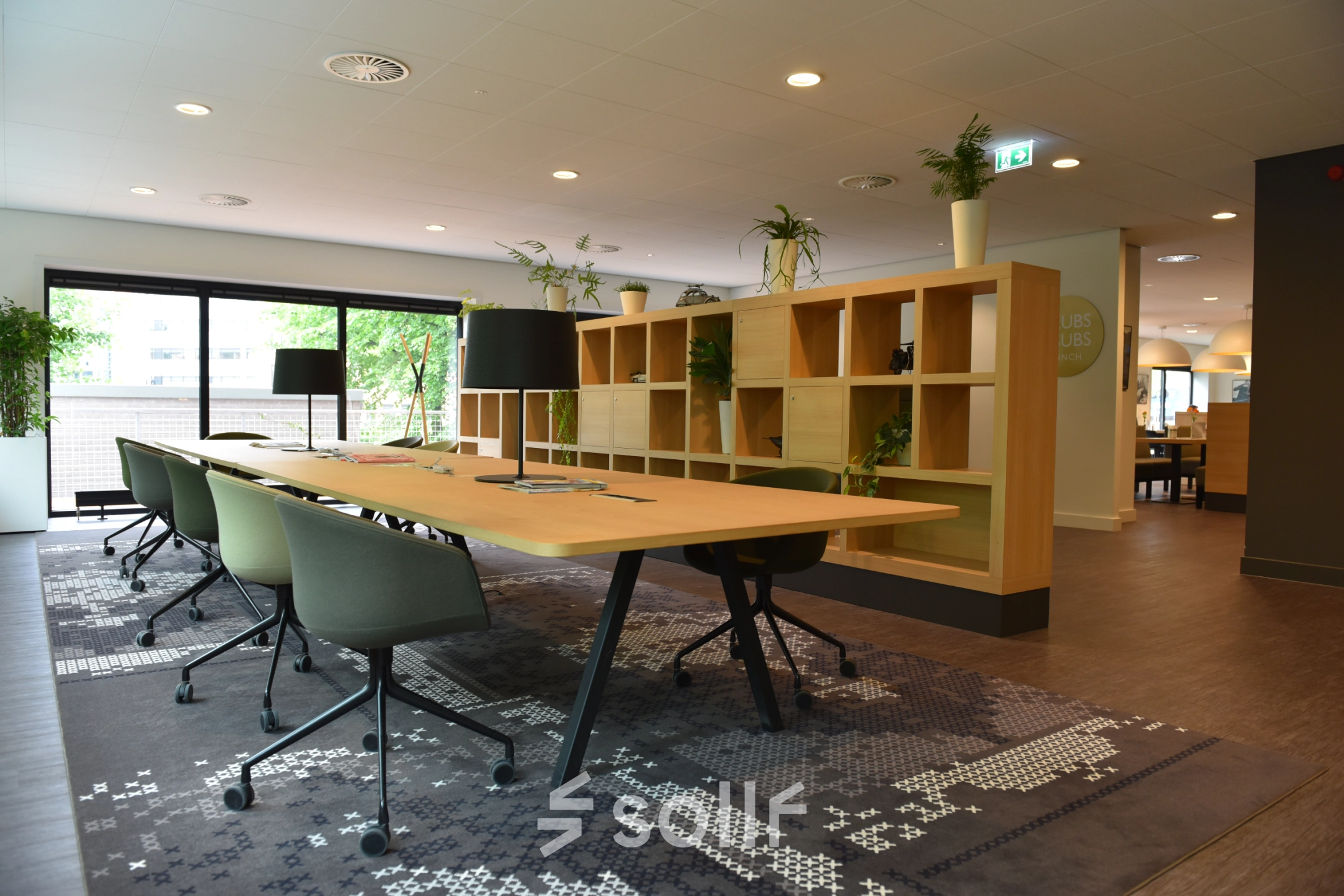 Modern office to rent at Laan van Vredenoord 33, Rijswijk. Features stylish furniture, vibrant decor, and ample natural light, perfect for office space rental.