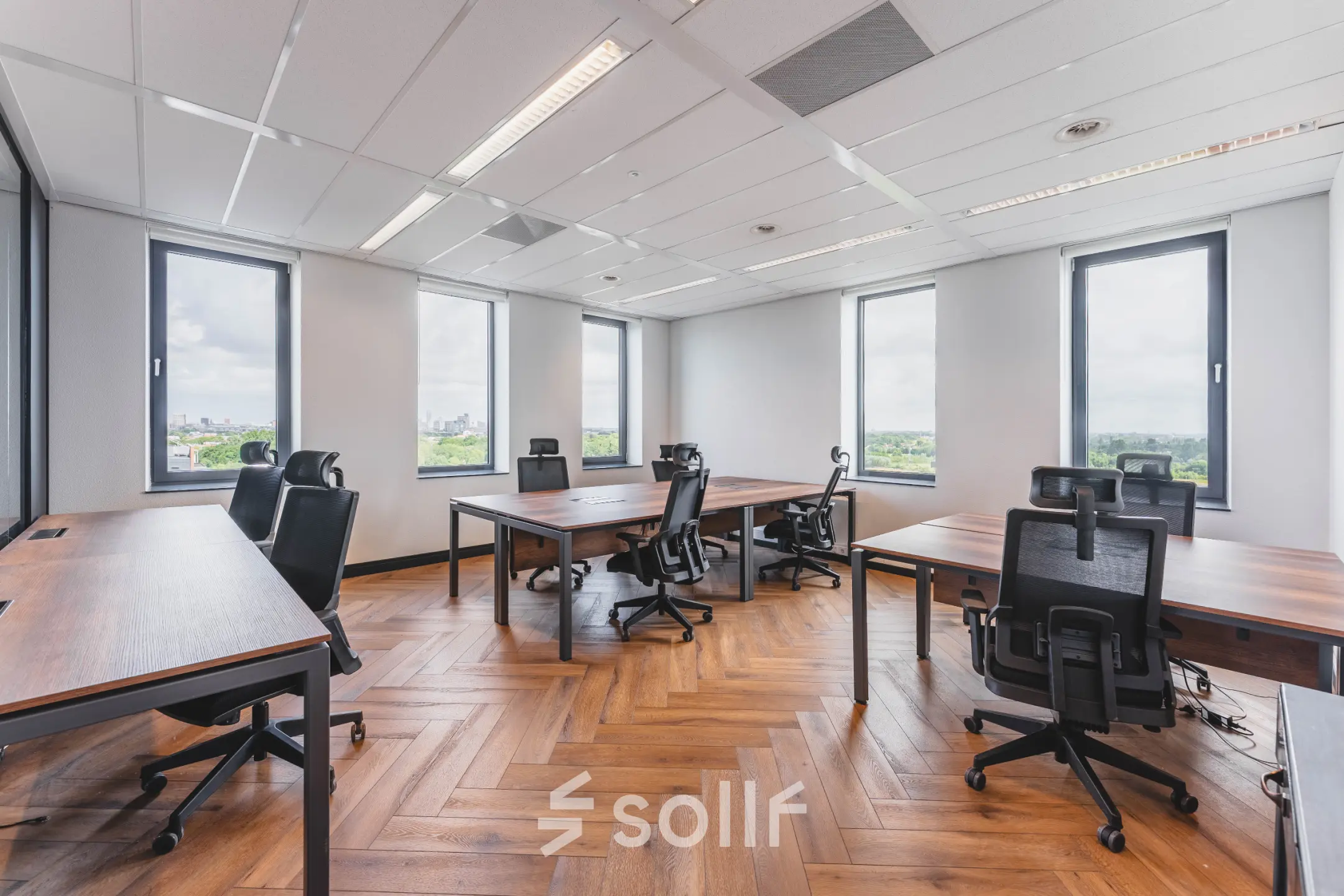 Spacious office to rent at Laan van Zuid Hoorn 70, Rijswijk, featuring modern furnishings and natural light from large windows, ideal for office space rental.