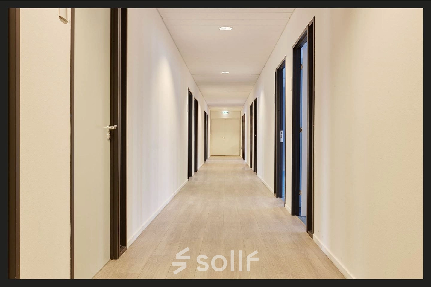 Office hallway at Patrijsweg 62, Rijswijk, featuring a series of doors leading to various office spaces. Ideal for office space rental.
