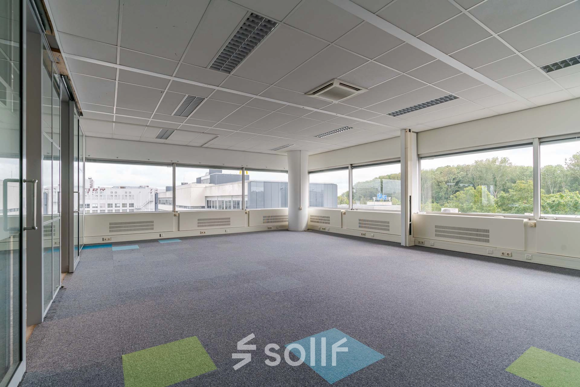 Spacious office to rent at Polakweg 7, Rijswijk, featuring large windows and an open floor plan ideal for office space rental.
