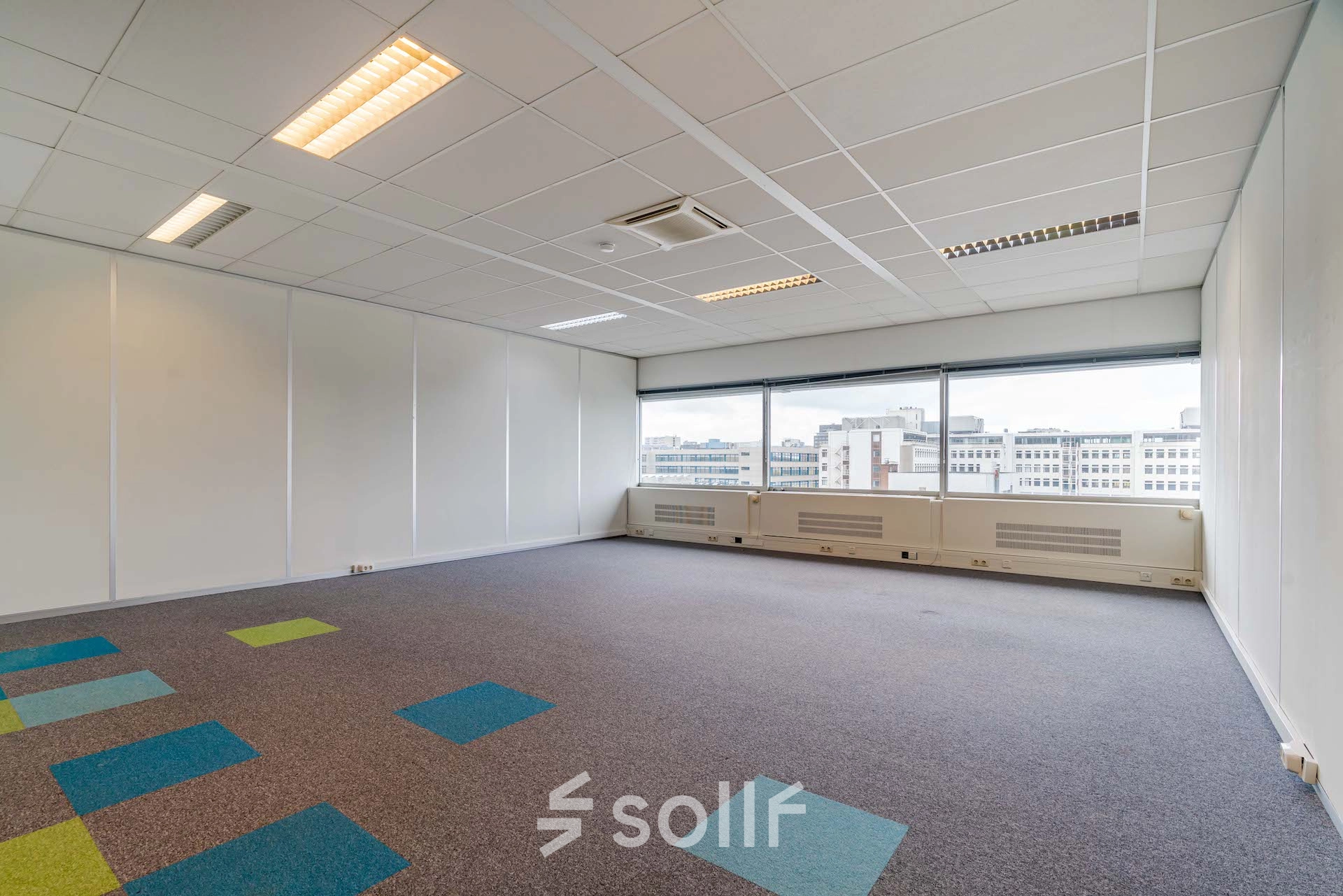 Bright office space at Polakweg 7, Rijswijk, featuring large windows with city views, suitable for office to rent.
