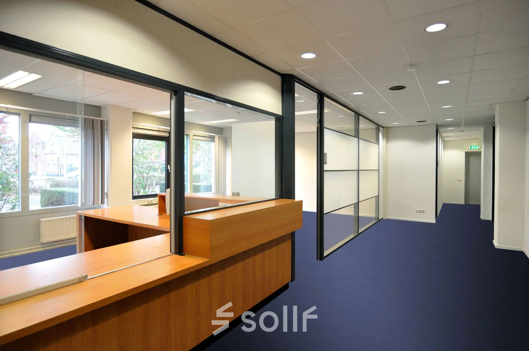Interior view of an office space rental at Laan van Brabant 70-86, Roosendaal, featuring glass partitions and wooden desks.