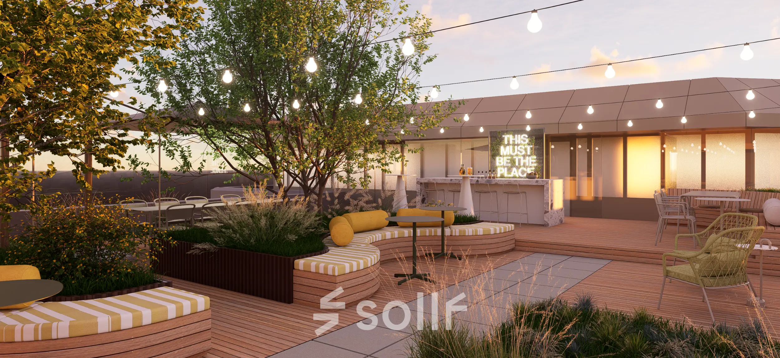 Outdoor rooftop space with wooden benches, plants, and a bar area under string lights, perfect for office space rental in Rotterdam Alexander.