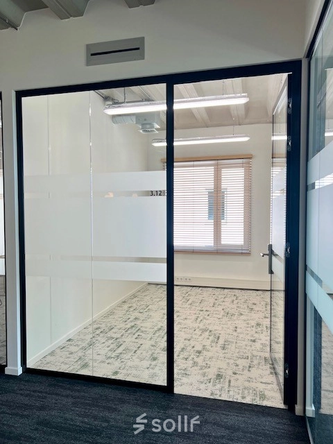 Unfurnished office space available for rent at Bahialaan 100, Rotterdam Brainpark, featuring large windows and modern design.