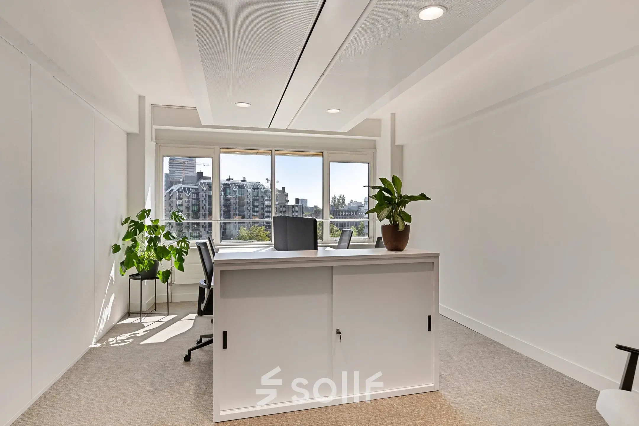 Bright furnished office space rental at Coolsingel 104, Rotterdam Center, with large windows, a few chairs, desks, and plants.