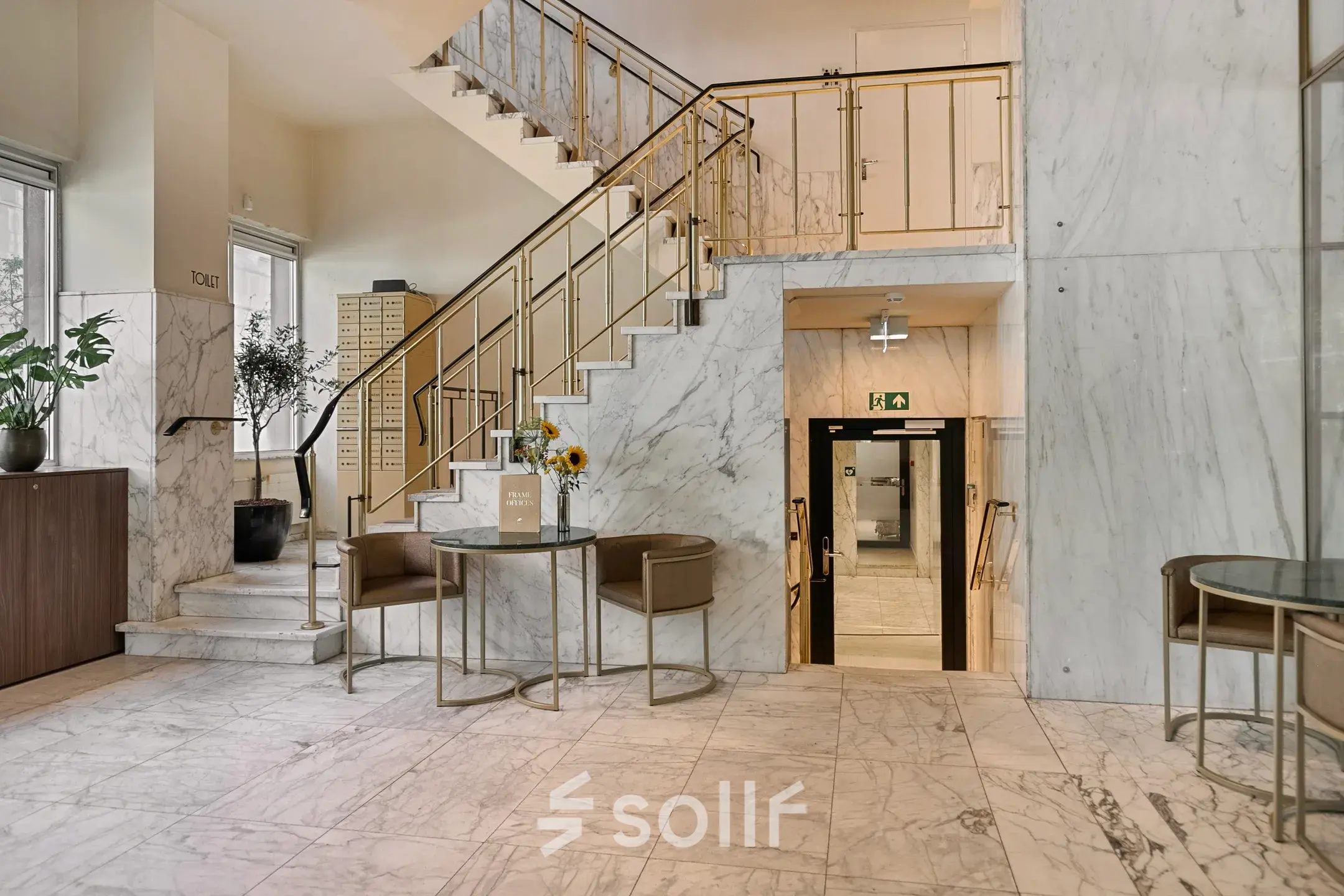 A stylish entryway with marble floors and walls at an office space available for rent on Coolsingel 104, Rotterdam Center.