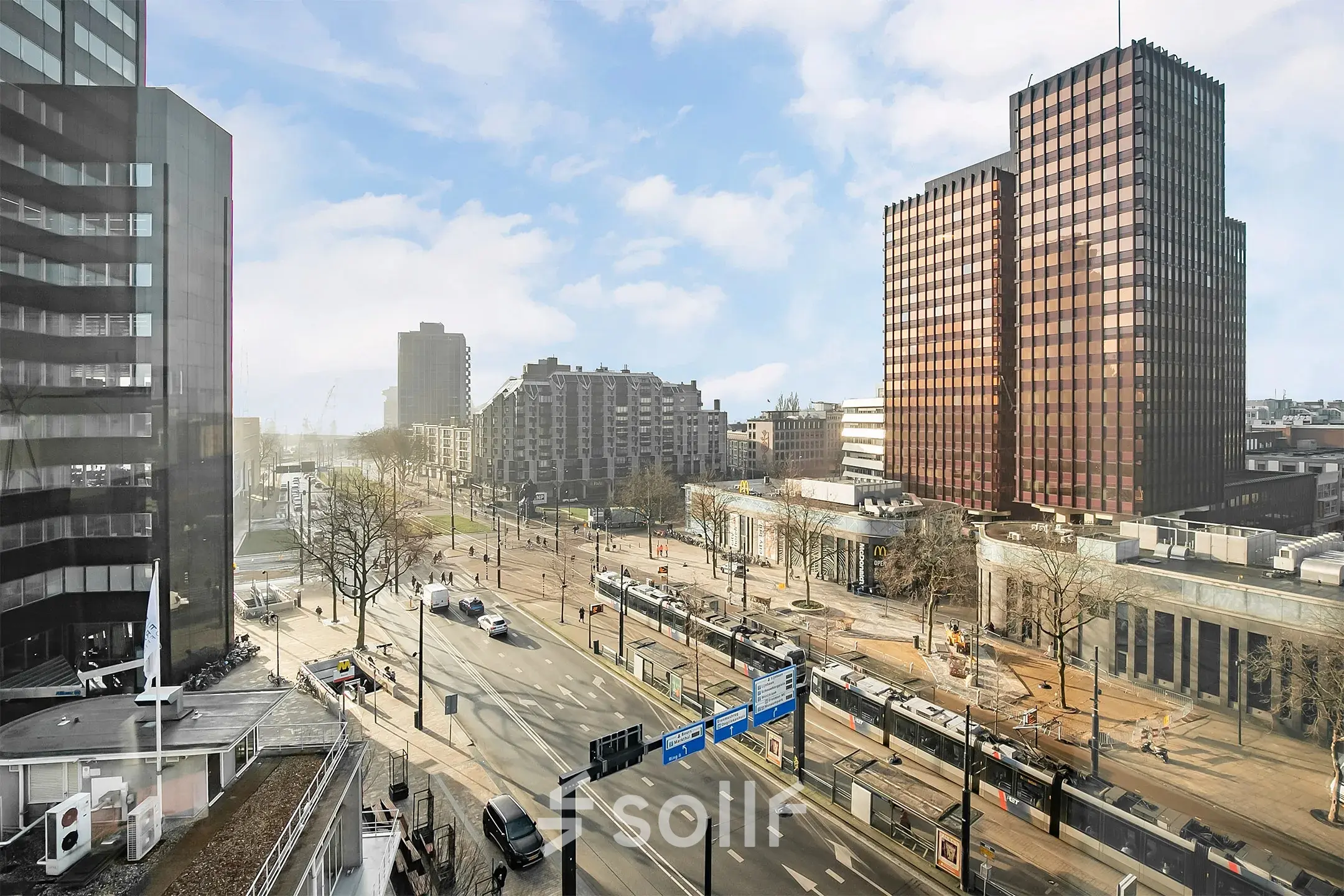 View of the busy urban landscape from an office to rent at Coolsingel 104 in Rotterdam Center, ideal for office space rental.
