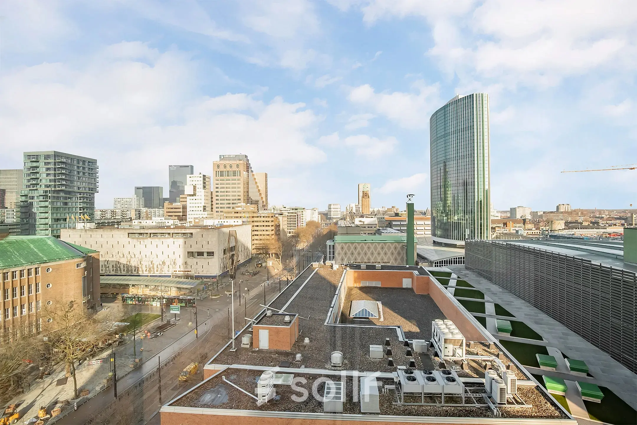View from an office located at Coolsingel 104, overlooking the skyline of Rotterdam Center, highlighting the vibrant urban setting.