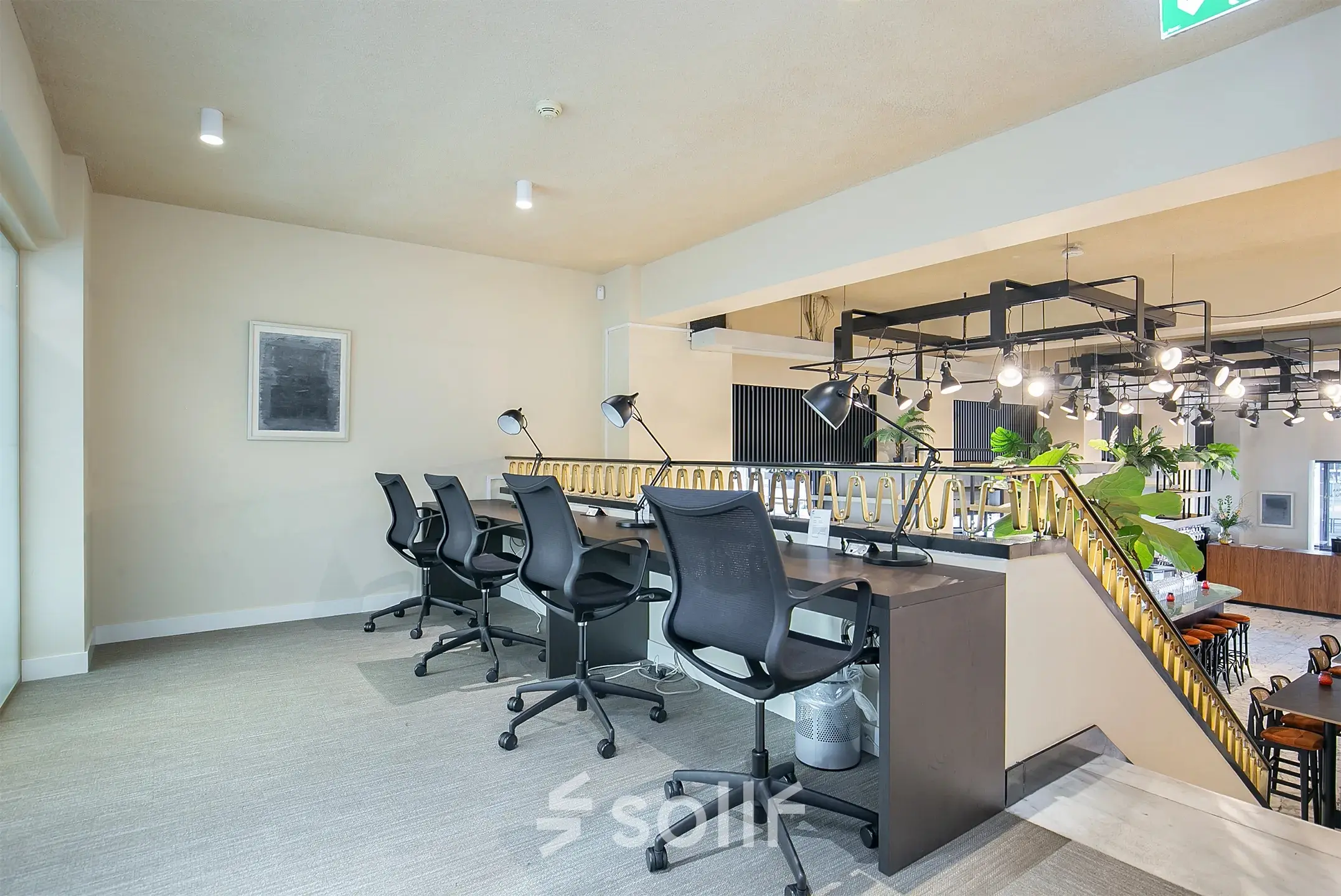 Modern, well-lit office space at Coolsingel 104 in Rotterdam Center, featuring a stylish desk area with chairs and lamps, perfect for rent office space opportunities.