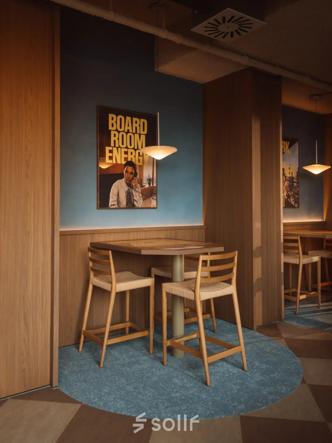 Stylish meeting area inside office space with wooden furniture and modern lighting, located at Coolsingel 139, Rotterdam Center. Ideal for office space rental.