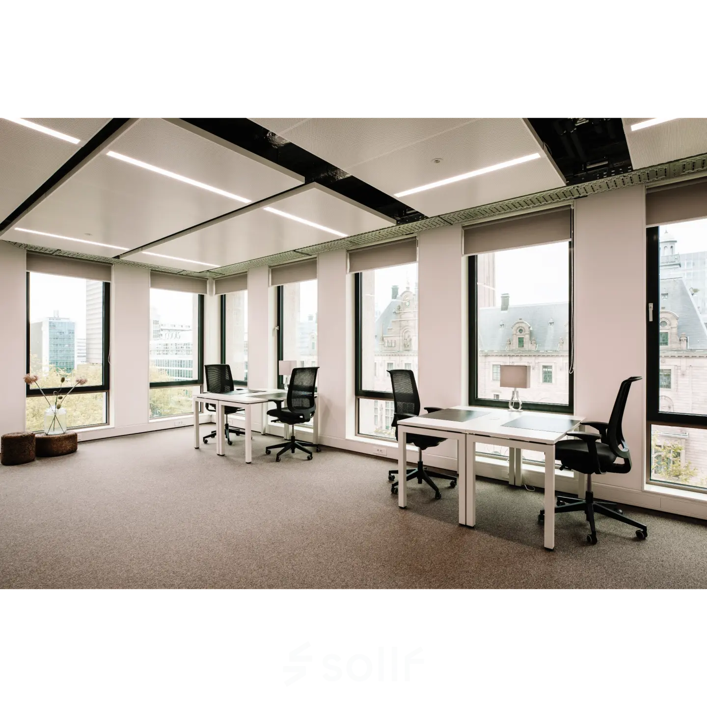 Bright office space at Coolsingel 65, Rotterdam Center with large windows and modern furnishings, perfect for office space rental.