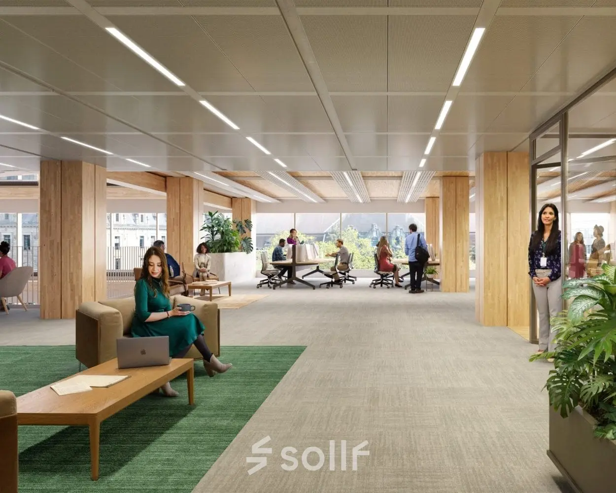 Modern office space at Coolsingel 75, Rotterdam Center, with professionals engaging in discussions and laptop work. Bright and furnished for office space rental.