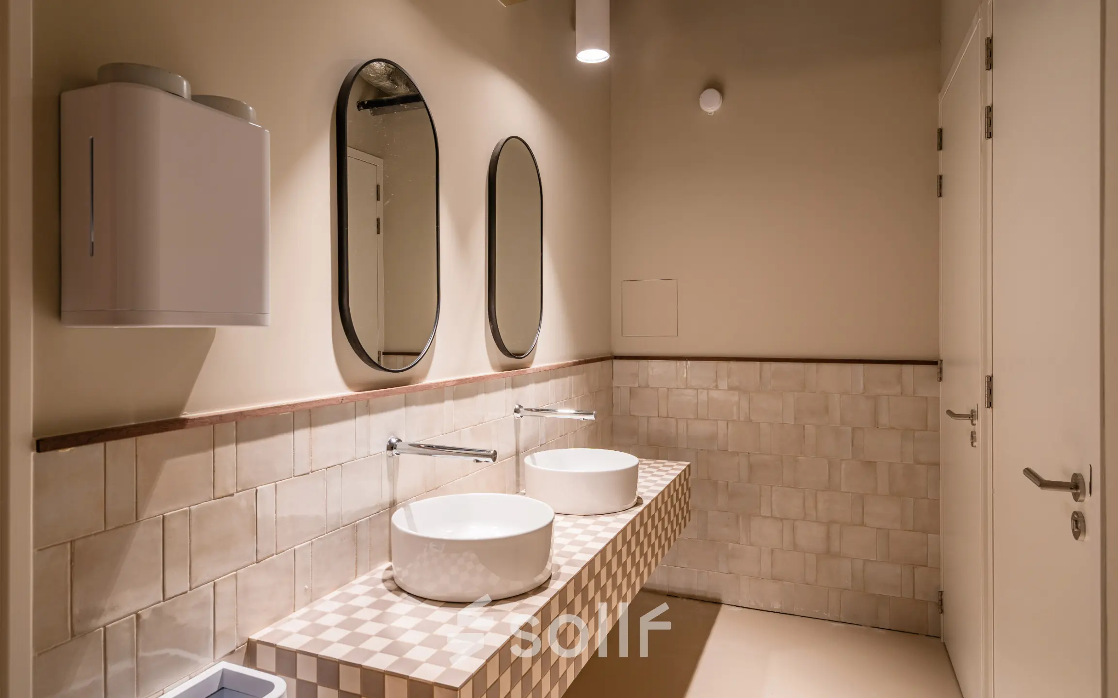 Modern restroom at Stadhuisplein 9-23 in Rotterdam Center, featuring chic tile design, offering a sleek addition to office space rental options.