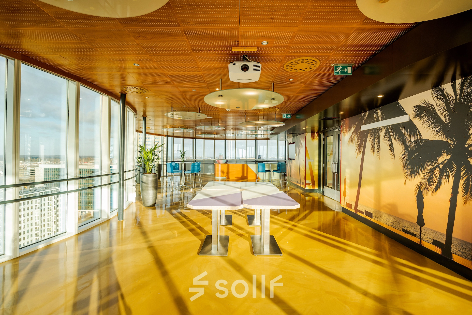 Spacious and modern office in Weena 70, Rotterdam Center with panoramic views and vibrant decor, ideal for office space rental.