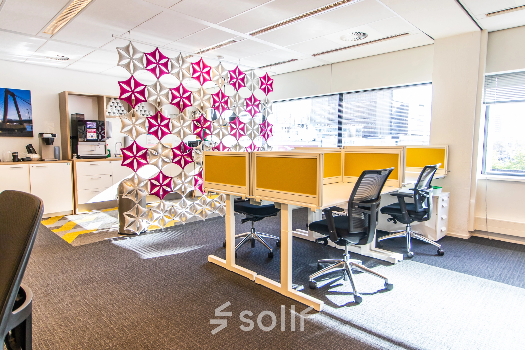 Bright office to rent at Weena-Zuid 130, Rotterdam Central Station, featuring a modern partition, four workstations, and abundant natural light.
