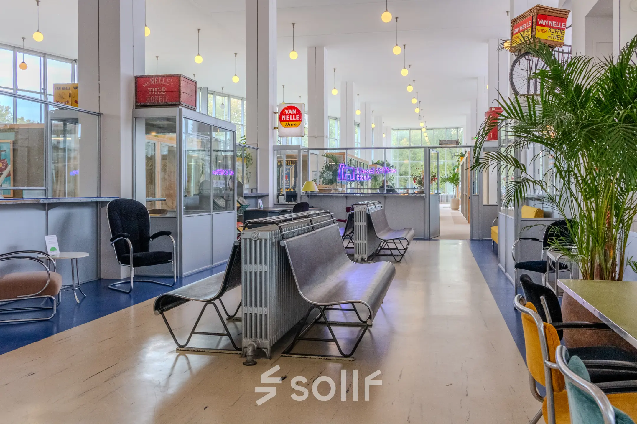 Spacious and bright office space rental in Rotterdam Delfshaven with modern furnishings, including chairs and tables. Ideal for dynamic work activities.