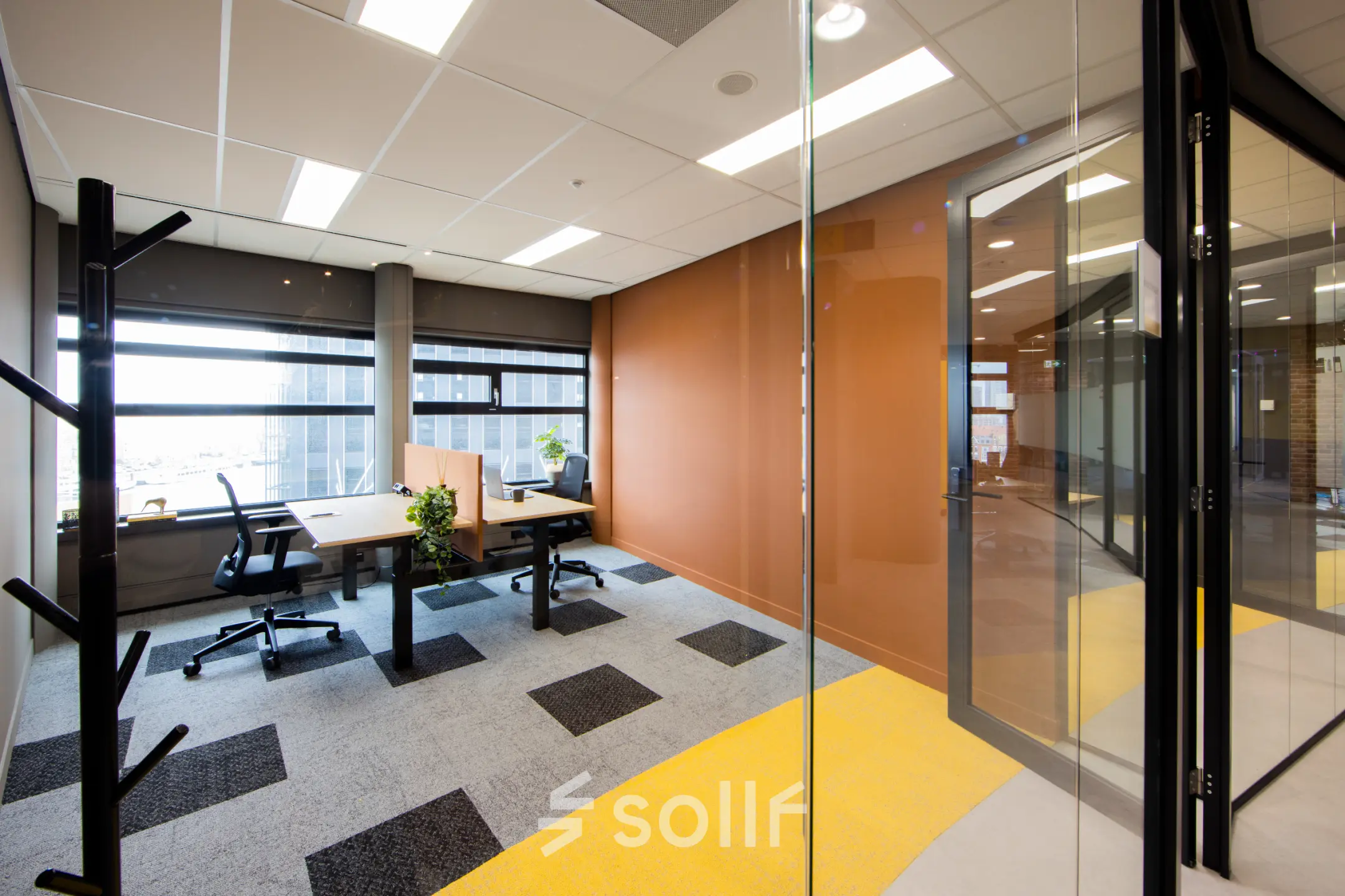 Modern office space for rent at Wilhelminaplein 1-40, Rotterdam Kop van Zuid, featuring large windows, natural light, and contemporary furnishings.
