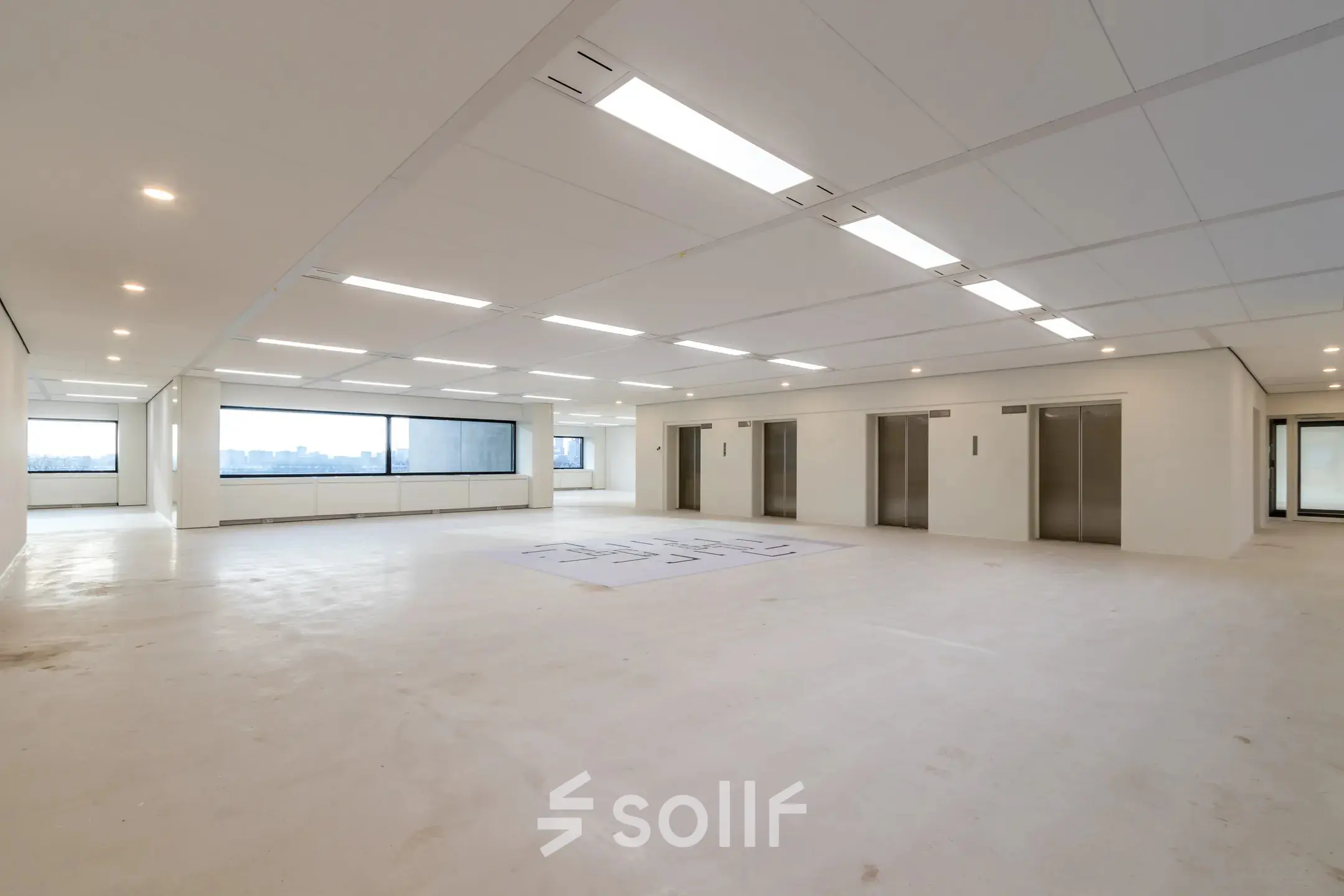 Spacious interior at Oostmaaslaan 71, Rotterdam Kralingen, ideal for office space rental with ample natural light and modern design.