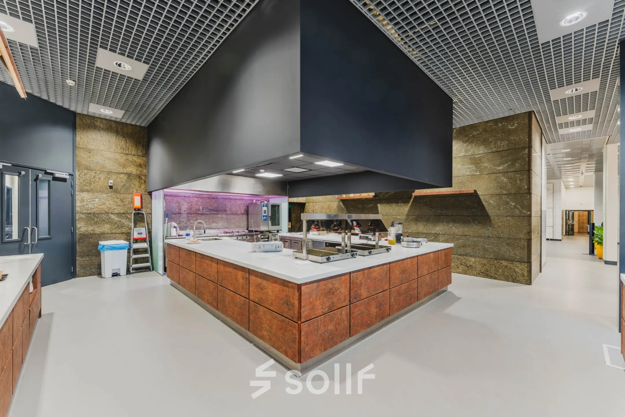 Modern kitchen area in an office space with ample counter area and contemporary design, located at Oostmaaslaan 71 for office space rental.