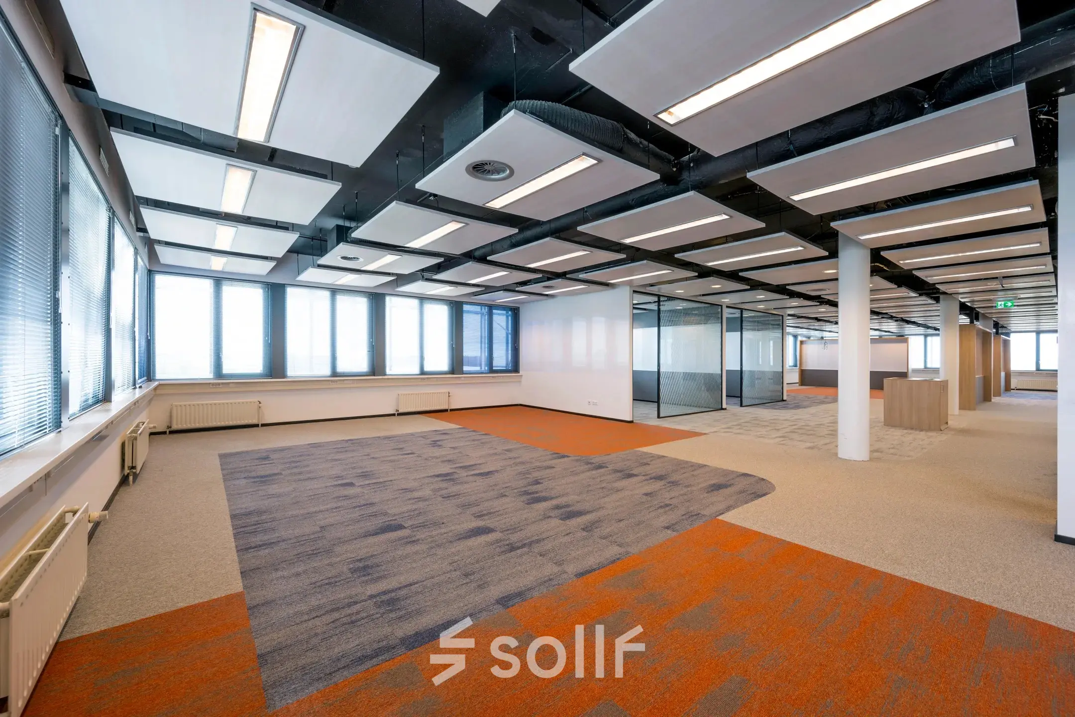 Spacious office space at Schiphol Airport, Folkstoneweg 2-56, featuring open-floor layout with modern lighting and ample natural light. Ideal for those looking for office space rental with customizable possibilities.
