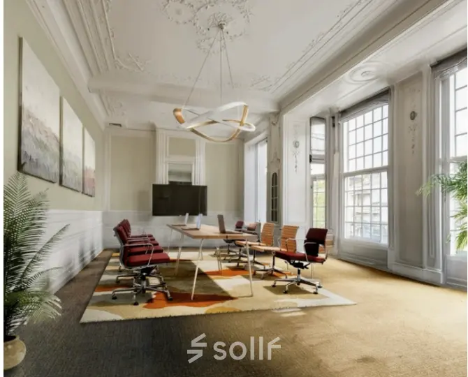 Elegant office to rent at Mauritskade 9, The Hague Center featuring modern decor, large windows, and a spacious conference setup.