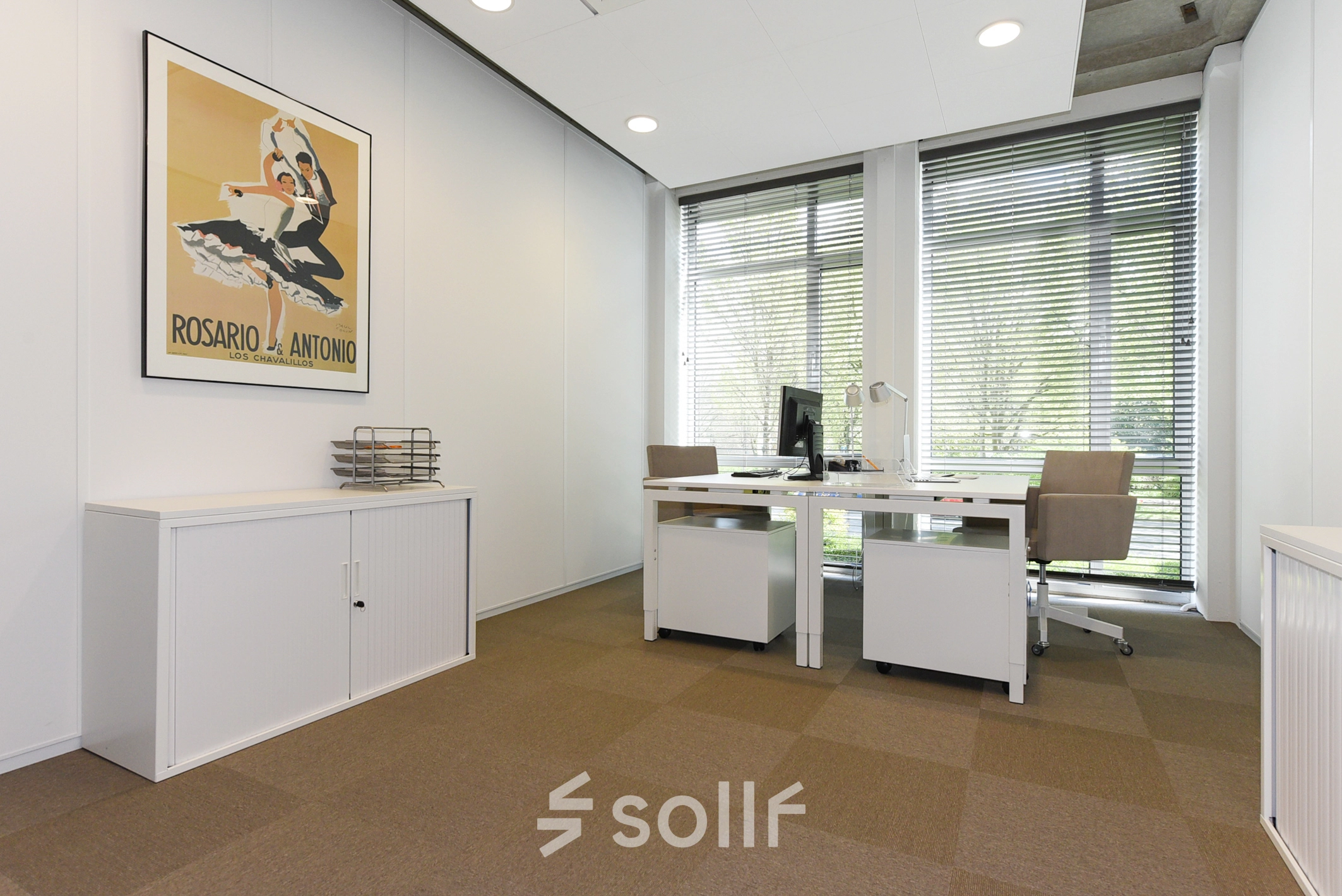 Bright office space with two desks, chairs, and cabinets in The Hague's Statenkwartier area. Ideal for those seeking office space rental with a professional and modern touch.