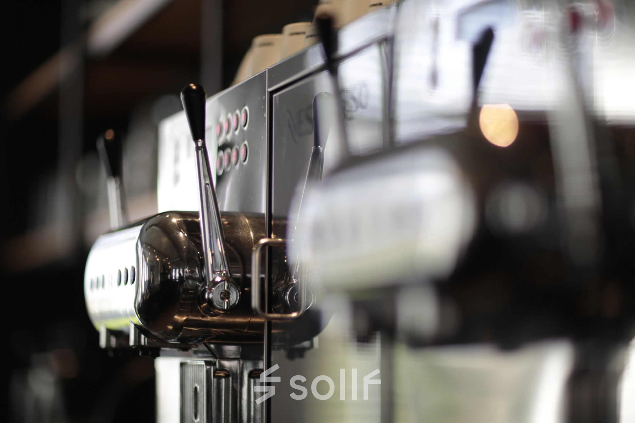 Close-up of coffee machines in an office space available for rent at President Kennedylaan 19, The Hague Statenkwartier.