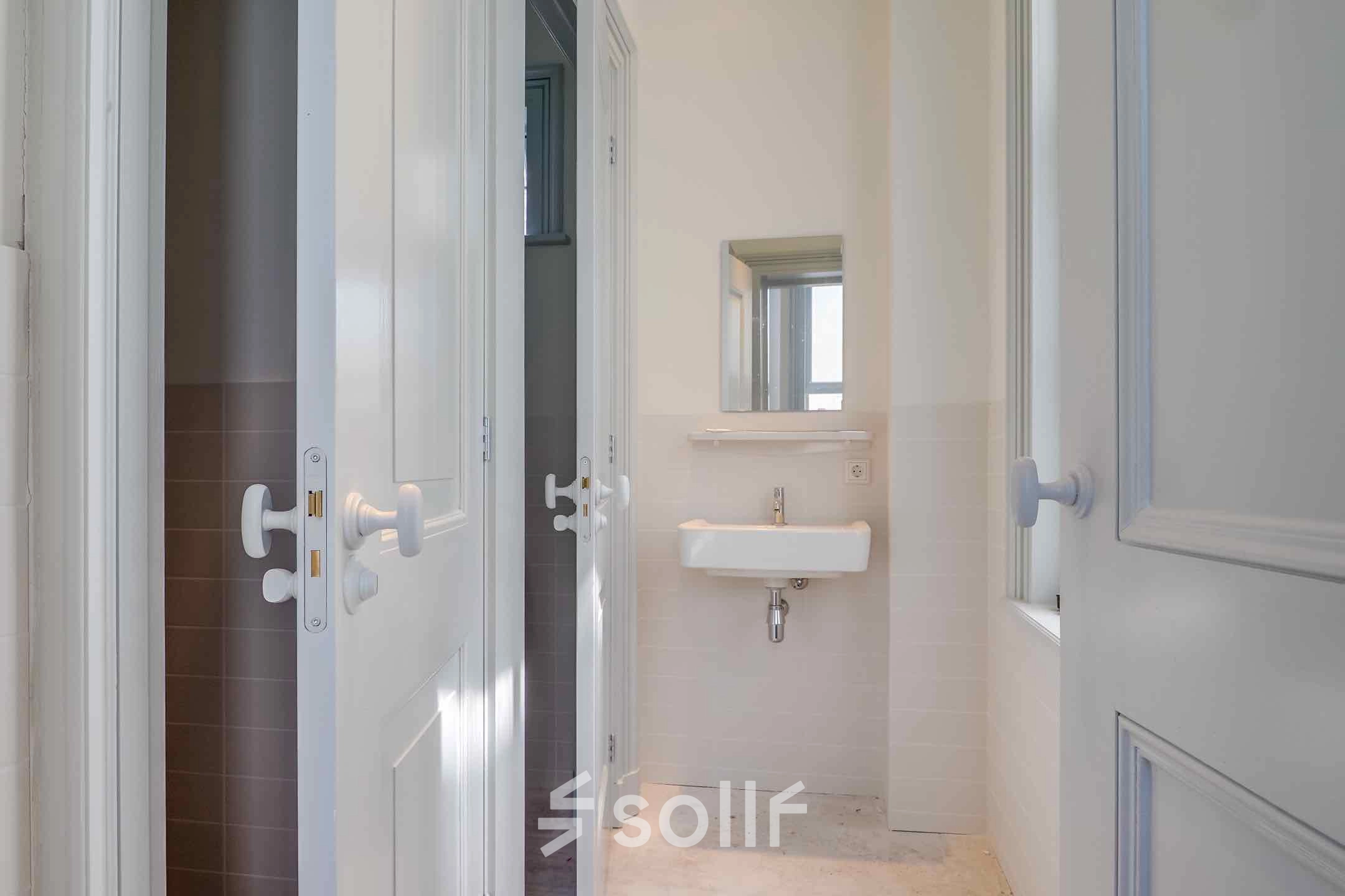 Bright office space to rent at Brigittenstraat 22, Utrecht Center, featuring a clean and functional restroom.