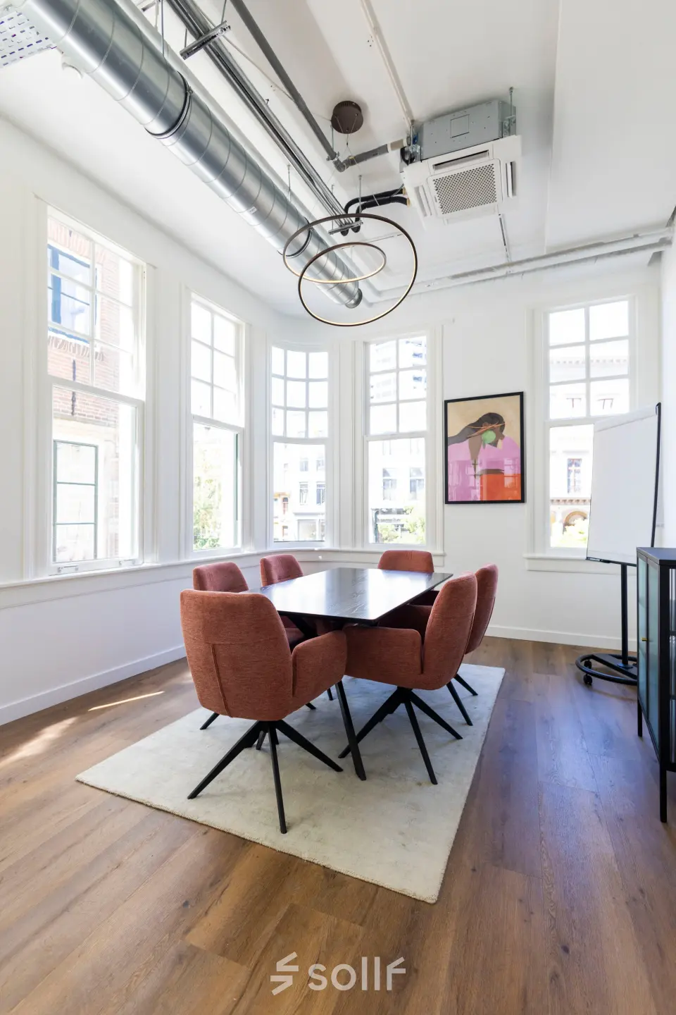 Bright office to rent at Oudegracht 161, Utrecht Center, featuring modern furniture and large windows, perfect for office space rental.