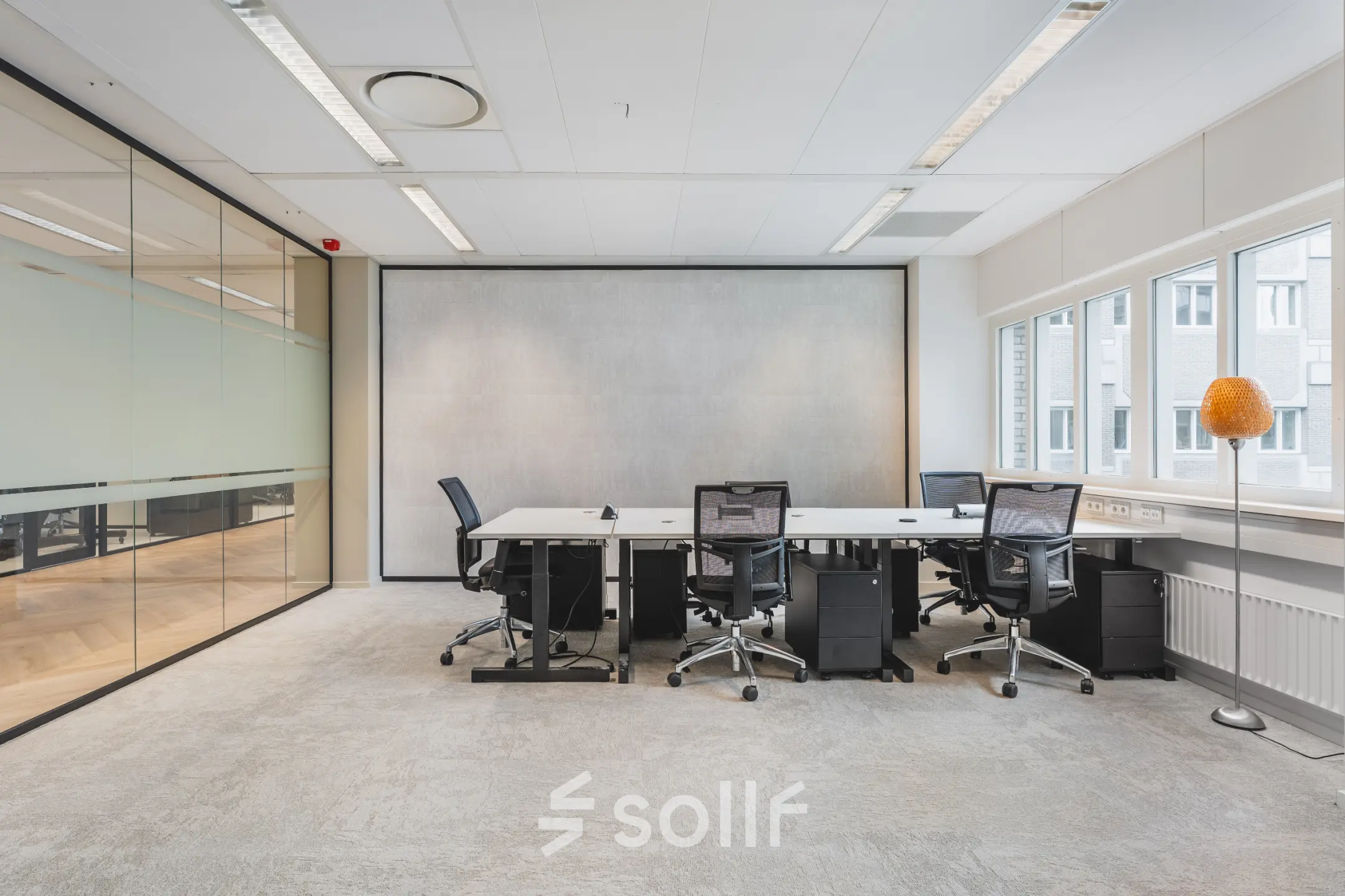 Modern office space at Leidseveer 2-10, Utrecht Central Station, featuring sleek workstations and ample natural light. Ideal for office space rental.