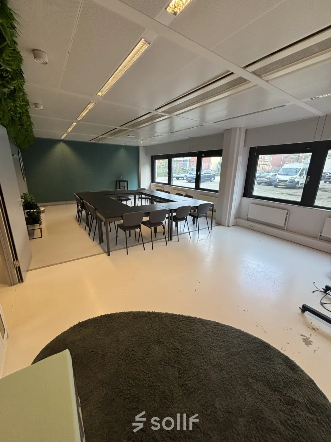 Spacious office space at Bernadottelaan 13, Utrecht Kanaleneiland with large conference table and chairs, ideal for meetings and office space rental.