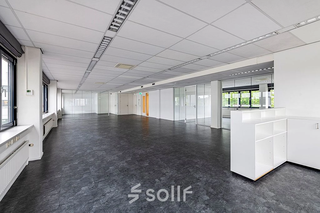 A spacious, unfurnished office interior at Atoomweg 350, Utrecht Lage Weide, perfect for rent office space. Bright and open, this office to rent offers versatility for various business activities.