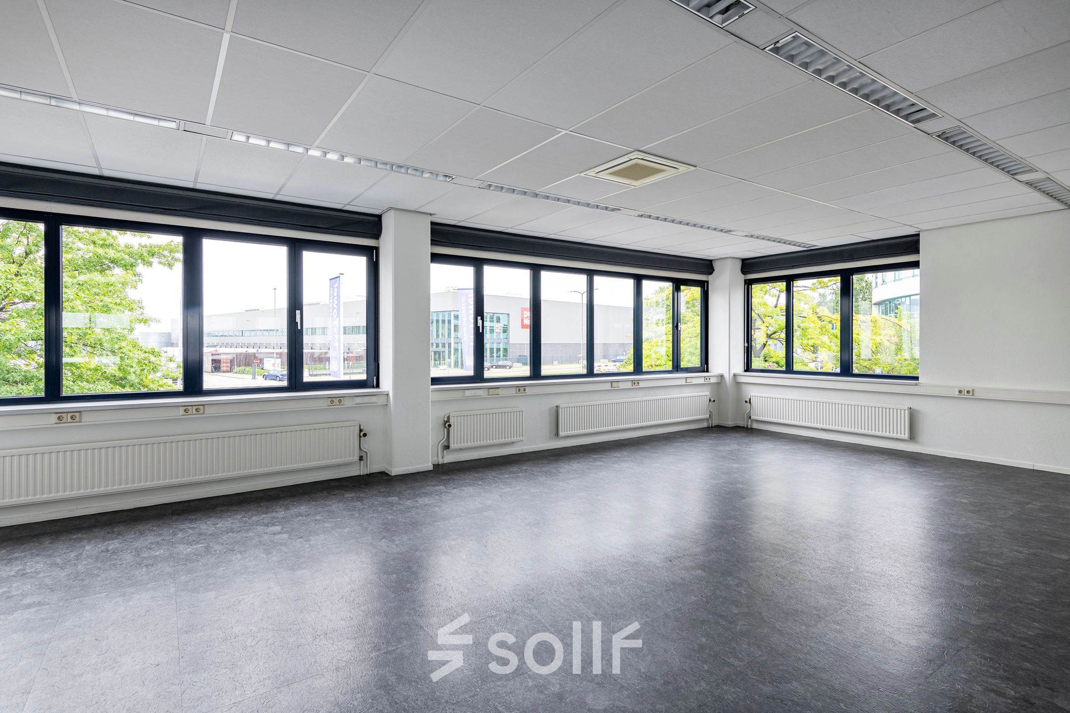 Bright, spacious office to rent at Atoomweg 350, Utrecht Lage Weide, featuring large windows with abundant natural light and a professional environment ideal for office space rental.