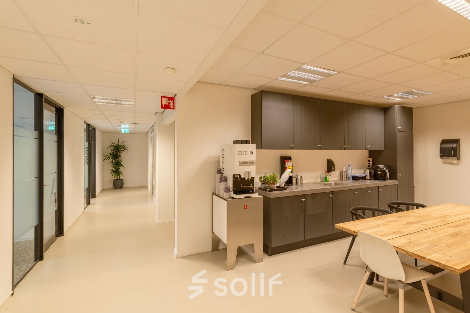 Furnished office kitchenette at Atoomweg 400, Utrecht Lage Weide, ideal for office space rental with seating and appliances.